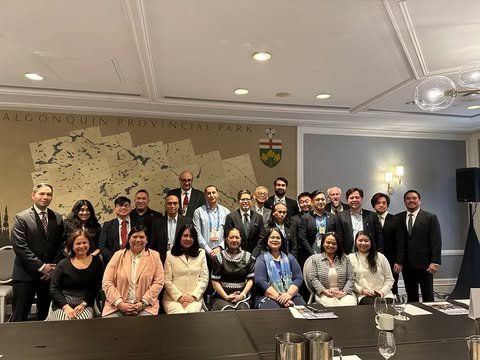 A delegation of Filipino participants in a meeting room during an international mining conference